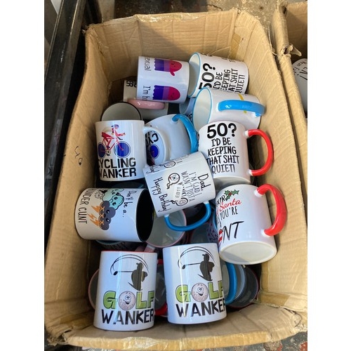 1611 - Two boxes containing assorted novelty mugs