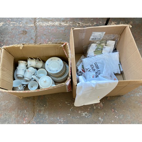 1614 - Two boxes containing ten novelty t-shirts and Chinese part tea set