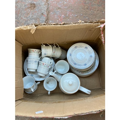 1614 - Two boxes containing ten novelty t-shirts and Chinese part tea set