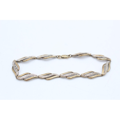 62 - A 9ct gold diamond set stylised link bracelet - approx. gross weight 3.8 grams