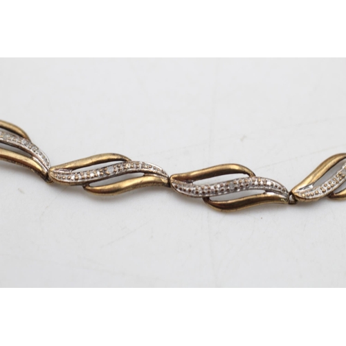 62 - A 9ct gold diamond set stylised link bracelet - approx. gross weight 3.8 grams