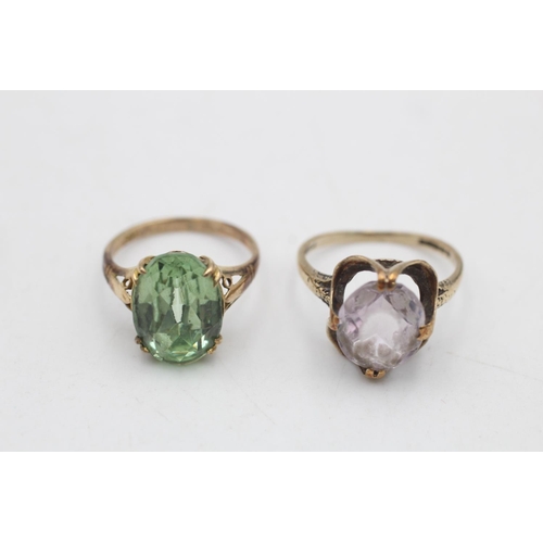 64 - Two 9ct gold gemstone solitaire cocktail rings, one amethyst size N and one paste size M - approx. g... 