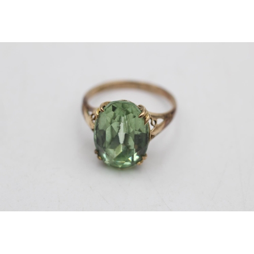64 - Two 9ct gold gemstone solitaire cocktail rings, one amethyst size N and one paste size M - approx. g... 