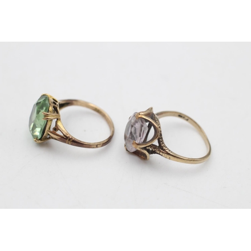 64 - Two 9ct gold gemstone solitaire cocktail rings, one amethyst size N and one paste size M - approx. g... 