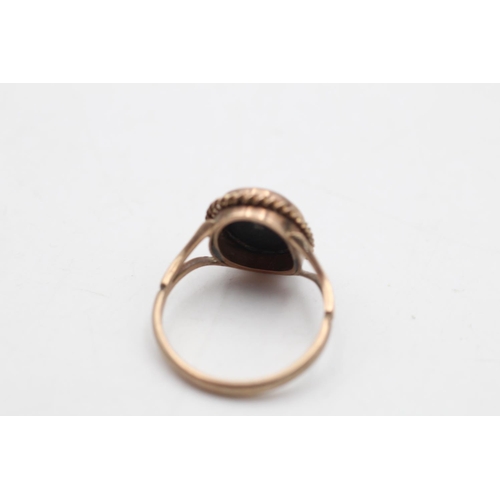 65 - A 9ct gold opal triplet solitaire bordered cocktail ring, size P½ - approx. gross weight 3.4 grams
