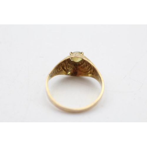 67 - A 9ct gold cat's eye chrysoberyl solitaire ornate dress ring, size S½ - approx. gross weight 2.7 gra... 