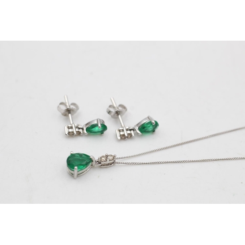 75 - A 9ct white gold synthetic emerald and diamond pendant necklace and drop earrings set - approx. gros... 