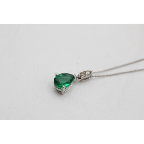 75 - A 9ct white gold synthetic emerald and diamond pendant necklace and drop earrings set - approx. gros... 