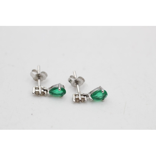 75 - A 9ct white gold synthetic emerald and diamond pendant necklace and drop earrings set - approx. gros... 