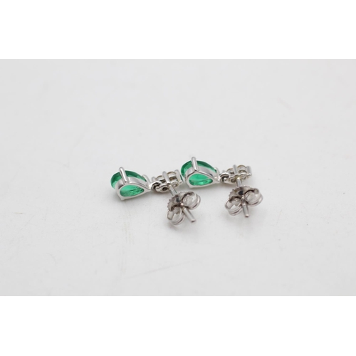 75 - A 9ct white gold synthetic emerald and diamond pendant necklace and drop earrings set - approx. gros... 