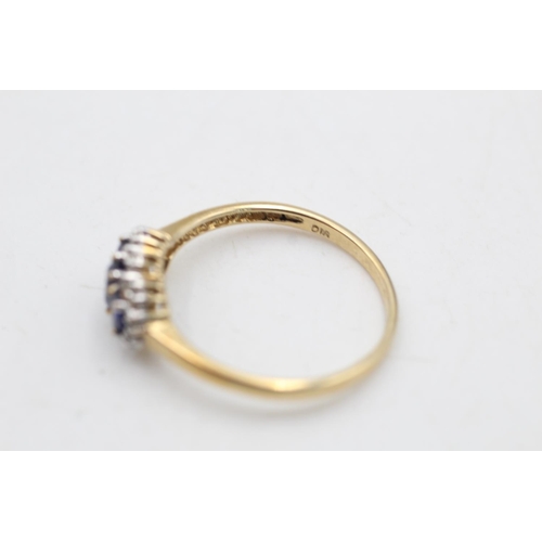 81 - A 9ct gold sapphire and diamond three stone halo dress ring, size R½ - approx. gross weight 2 grams
