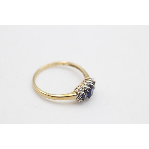 81 - A 9ct gold sapphire and diamond three stone halo dress ring, size R½ - approx. gross weight 2 grams