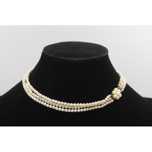 87 - A pearl three strand necklace with 9ct gold clasp - approx. gross weight 19.3 grams