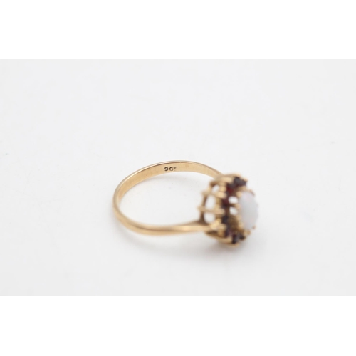 91 - A 9ct gold opal and garnet halo ring, size O - approx. gross weight 2.5 grams