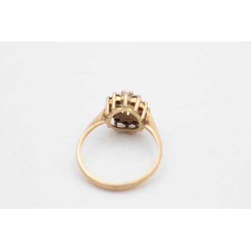 91 - A 9ct gold opal and garnet halo ring, size O - approx. gross weight 2.5 grams