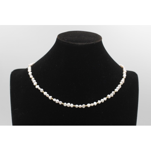 98 - A 14ct gold and freshwater pearl necklace - approx. gross weight 16.9 grams
