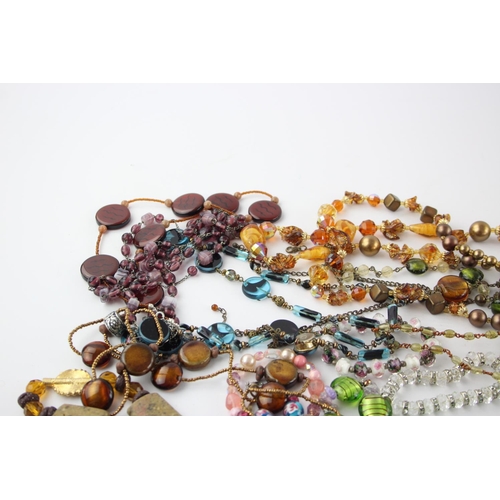 105 - Fifty pieces of assorted glass costume jewellery to include bracelets, necklaces etc.