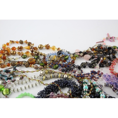 105 - Fifty pieces of assorted glass costume jewellery to include bracelets, necklaces etc.