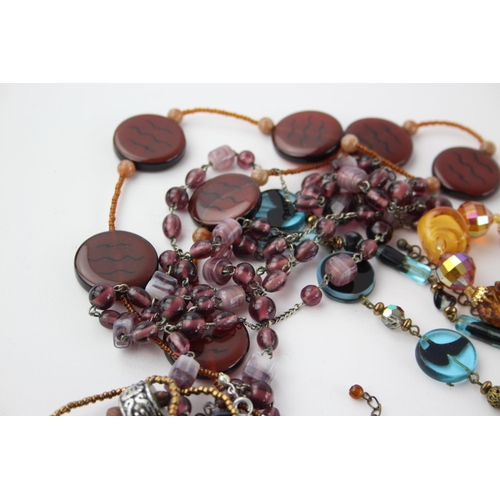 105 - Fifty pieces of assorted glass costume jewellery to include bracelets, necklaces etc.