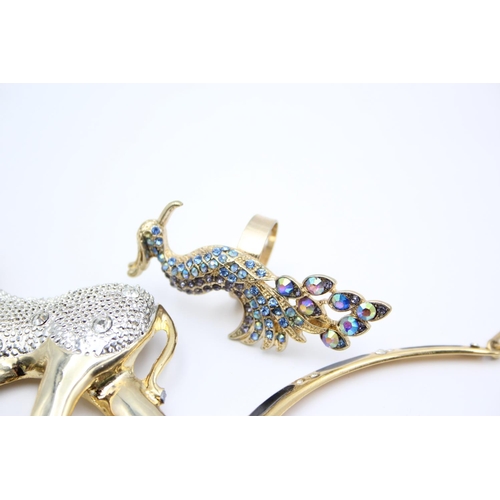 106 - Seventeen pieces of statement costume jewellery to include necklaces, brooches etc.