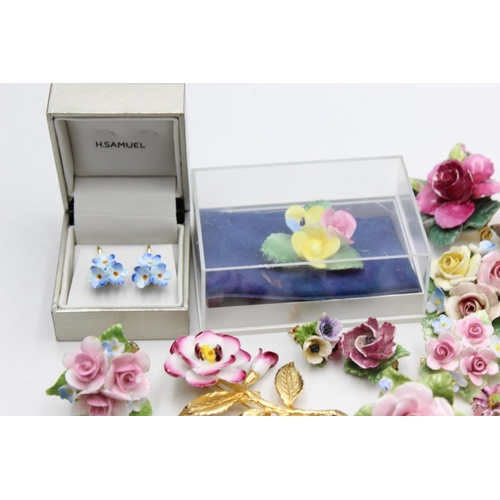 114 - Twenty five pieces of porcelain jewellery to include brooches, pins etc.