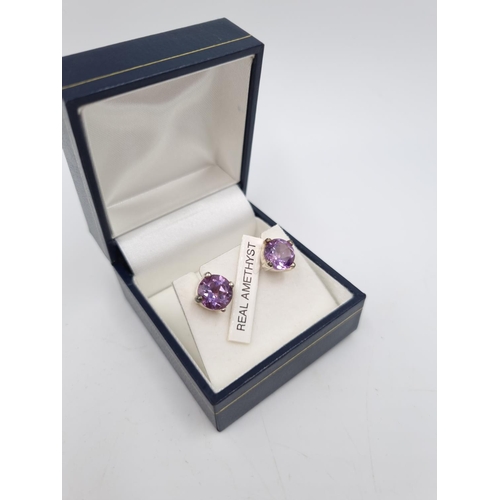 101 - A collection of .925 silver and white metal items to include three .925 silver bangles, Pandora char... 