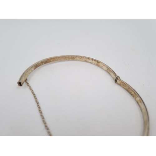 101 - A collection of .925 silver and white metal items to include three .925 silver bangles, Pandora char... 
