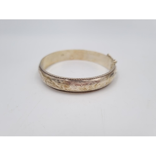 101 - A collection of .925 silver and white metal items to include three .925 silver bangles, Pandora char... 