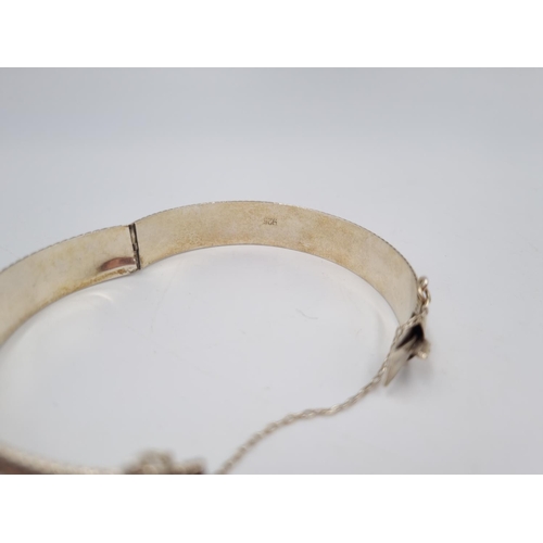 101 - A collection of .925 silver and white metal items to include three .925 silver bangles, Pandora char... 
