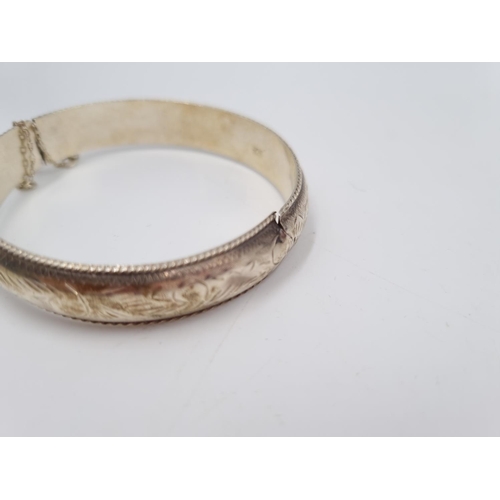 101 - A collection of .925 silver and white metal items to include three .925 silver bangles, Pandora char... 