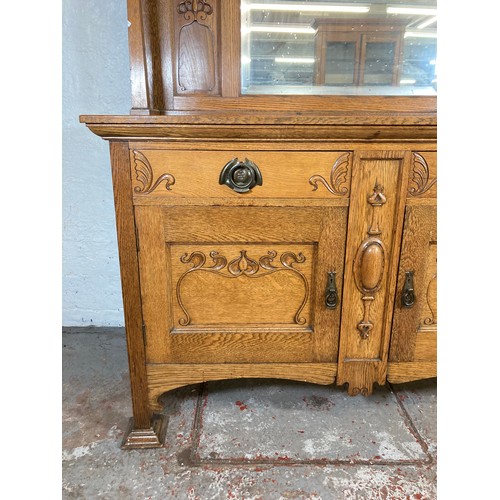 1135 - An Art Nouveau oak mirror back sideboard - approx. 167.5cm high x 151cm wide x 55.5cm deep