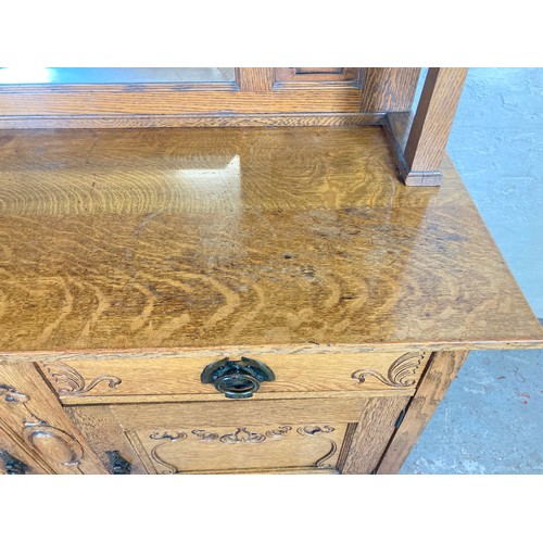 1135 - An Art Nouveau oak mirror back sideboard - approx. 167.5cm high x 151cm wide x 55.5cm deep