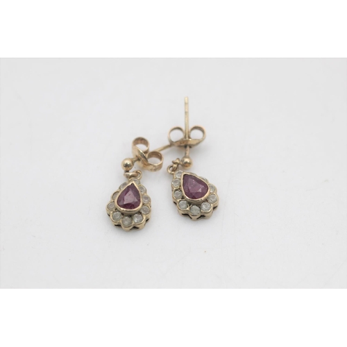 1 - Two pairs of 9ct gold gemstone stud and drop earrings, one topaz and one ruby and clear gemstone - a... 