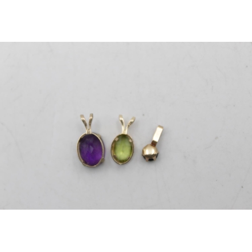 103 - Three 9ct gold gemstone pendants, one amethyst, one sapphire and one peridot - approx. gross weight ... 