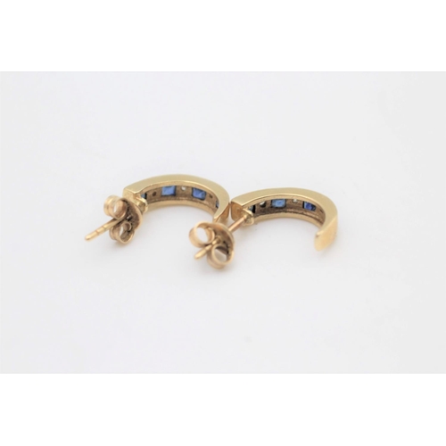 105 - A pair of 9ct gold sapphire and diamond half hoop earrings - approx. gross weight 1.7 grams