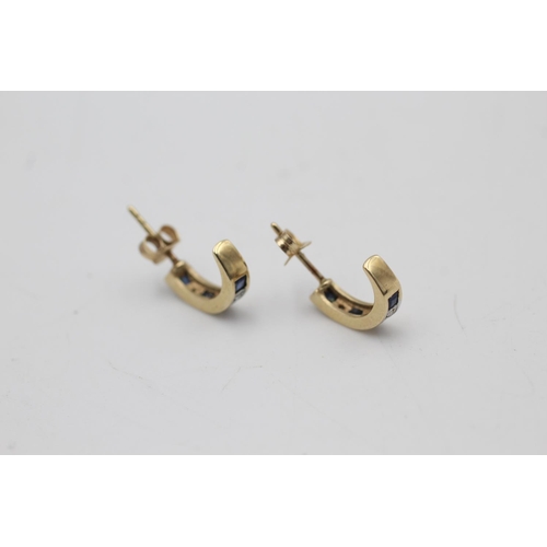 105 - A pair of 9ct gold sapphire and diamond half hoop earrings - approx. gross weight 1.7 grams