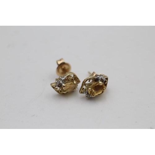 118 - A 9ct gold citrine and diamond stud earrings - approx. gross weight 1.3 grams