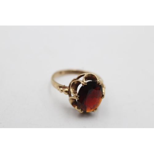 12 - A hallmarked Birmingham 9ct gold garnet dress ring, size H½ - approx. gross weight 2.1 grams