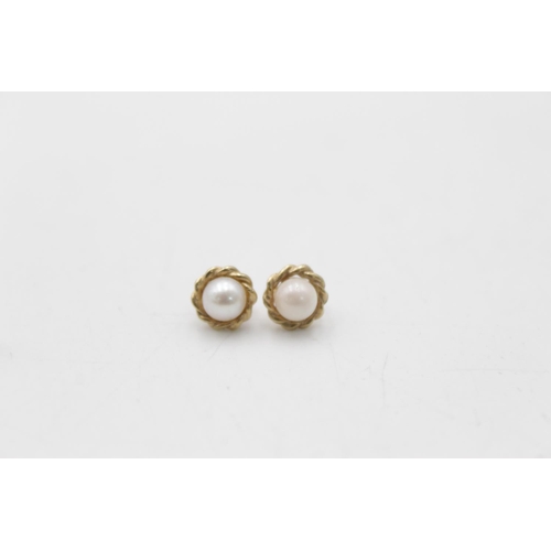 121 - Two pairs of 9ct gold pearl paired earrings, one stud and one drop - approx. gross weight 2.3 grams