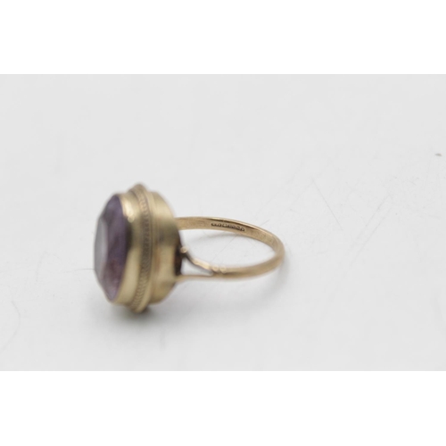 13 - A hallmarked Birmingham 9ct gold amethyst dress ring, size K½ - approx. gross weight 3.4 grams