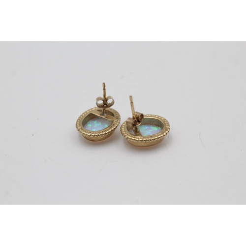 133 - A pair of 9ct gold opal stud earrings - approx. gross weight 2.8 grams