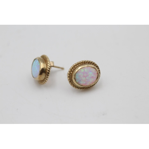 133 - A pair of 9ct gold opal stud earrings - approx. gross weight 2.8 grams