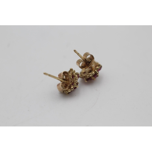 136 - A pair of 9ct gold ruby flower stud earrings - approx. gross weight 1 gram