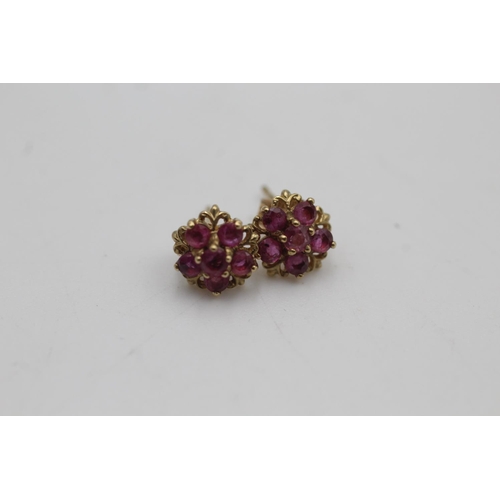 136 - A pair of 9ct gold ruby flower stud earrings - approx. gross weight 1 gram