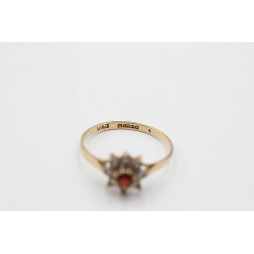 137 - A 9ct gold vintage diamond and garnet flower ring, size Q - approx. gross weight 1.4 grams