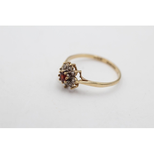 137 - A 9ct gold vintage diamond and garnet flower ring, size Q - approx. gross weight 1.4 grams