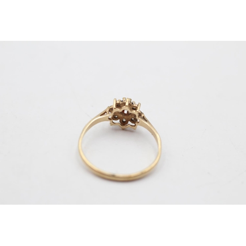 137 - A 9ct gold vintage diamond and garnet flower ring, size Q - approx. gross weight 1.4 grams