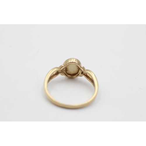 14 - A 9ct gold opal twist ring, size N½ - approx gross weight 2.1 grams