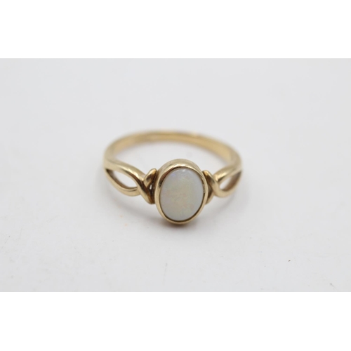 14 - A 9ct gold opal twist ring, size N½ - approx gross weight 2.1 grams