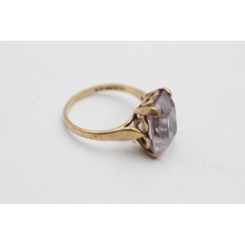 142 - A hallmarked London 9ct gold amethyst cocktail ring, size M½ - approx. gross weight 3.1 grams